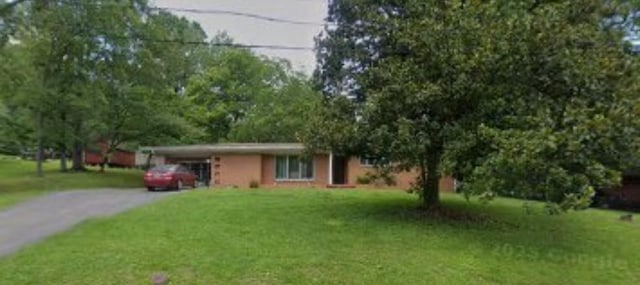 1822 Parkview Ter, Pulaski, TN 38478 - ranch-style house featuring an attached carport, driveway, and a front lawn