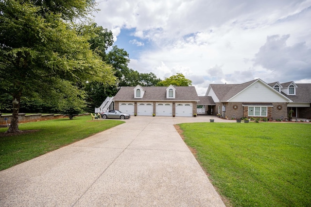 627 Eastbrook Rd, Estill Springs, TN 37330 - view of front of house with driveway, a front yard, a garage, and brick siding