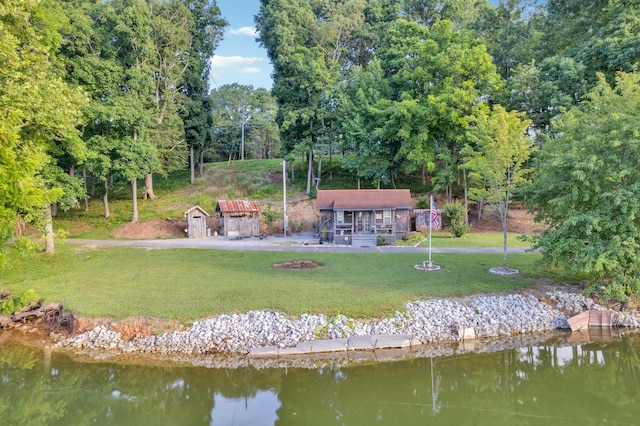 627 Eastbrook Rd, Estill Springs, TN 37330 - view of home's community with a water view, a lawn, and a storage shed