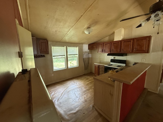 211 Pinetree Rd, Sewanee, TN 37375 - kitchen featuring ceiling fan, a peninsula, range with electric cooktop, light wood-style floors, and brown cabinetry