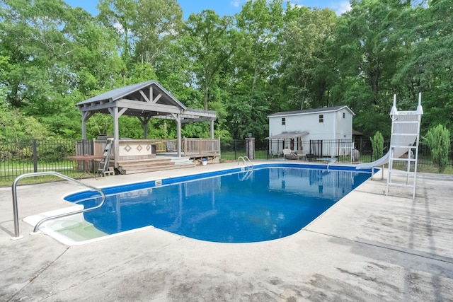 6685 Lynchburg Rd, Winchester, TN 37398 - view of swimming pool featuring a water slide, a gazebo, a patio, and view of scattered trees