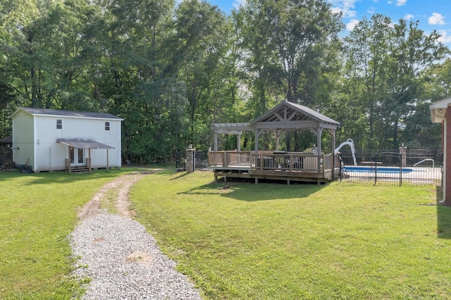 6685 Lynchburg Rd, Winchester, TN 37398 - view of yard featuring a pergola, driveway, an outbuilding, and view of wooded area