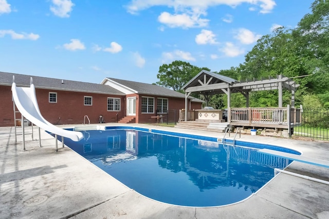 6685 Lynchburg Rd, Winchester, TN 37398 - view of swimming pool with a diving board, a water slide, a pergola, a patio, and a deck