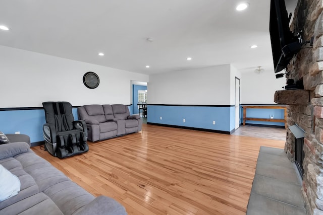 6685 Lynchburg Rd, Winchester, TN 37398 - living room featuring a stone fireplace, light wood-type flooring, and recessed lighting