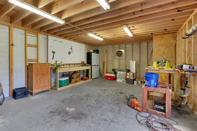 6685 Lynchburg Rd, Winchester, TN 37398 - basement featuring a workshop area and freestanding refrigerator