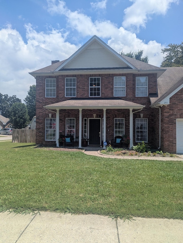 201 Foster Dr, White House, TN 37188 - traditional-style house featuring a porch and brick siding