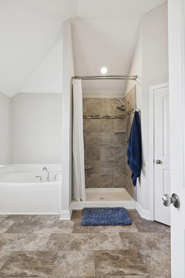 2237 Pathfinder Dr, Murfreesboro, TN 37127 - bathroom featuring lofted ceiling, a garden tub, and a tile shower