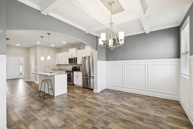 2237 Pathfinder Dr, Murfreesboro, TN 37127 - kitchen with a chandelier, beam ceiling, stainless steel appliances, plenty of natural light, and a decorative wall