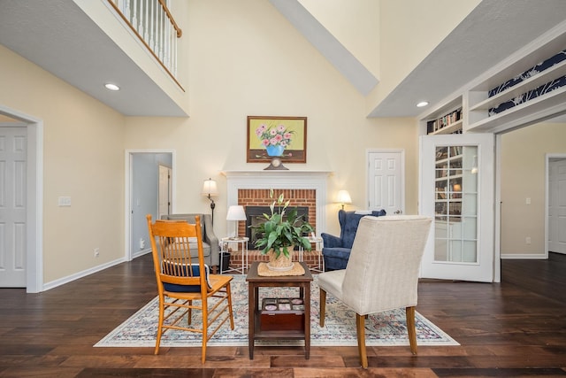 702 John Windrow Rd, Eagleville, TN 37060 - living area featuring wood-type flooring, a brick fireplace, high vaulted ceiling, recessed lighting, and built in features