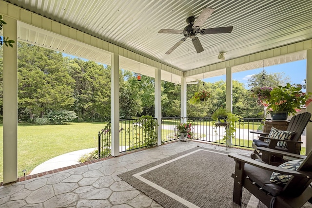 702 John Windrow Rd, Eagleville, TN 37060 - sunroom / solarium with ceiling fan, view of wooded area, and plenty of natural light