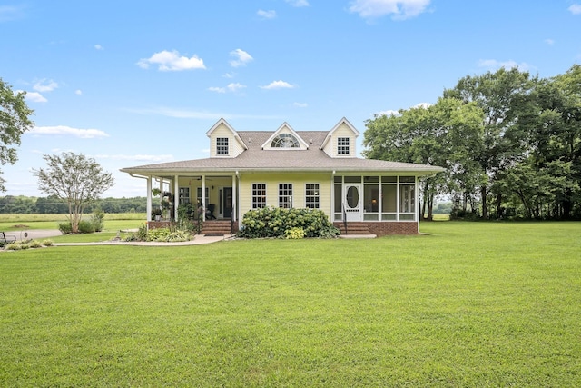 702 John Windrow Rd, Eagleville, TN 37060 - view of front of home with a sunroom, a front yard, covered porch, and a shingled roof