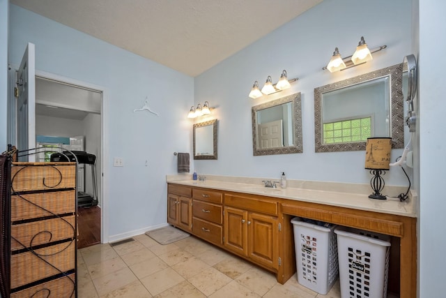 702 John Windrow Rd, Eagleville, TN 37060 - bathroom with double vanity and baseboards