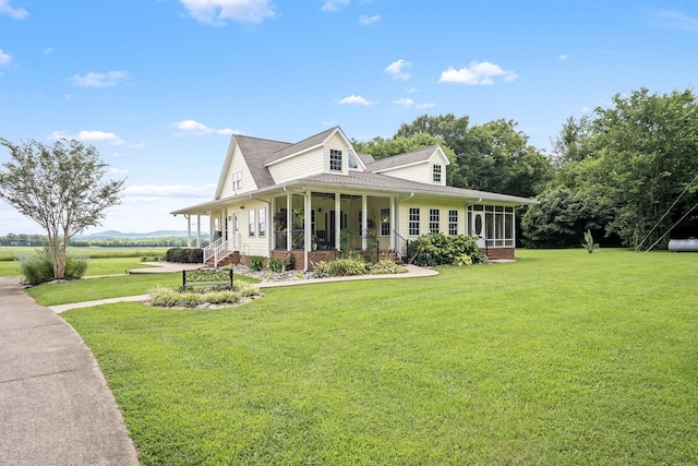 702 John Windrow Rd, Eagleville, TN 37060 - view of front of house with a sunroom, a front lawn, and a shingled roof