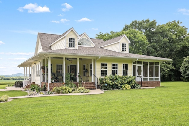 702 John Windrow Rd, Eagleville, TN 37060 - view of front of property featuring roof with shingles, a sunroom, a front lawn, covered porch, and ceiling fan