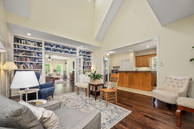 702 John Windrow Rd, Eagleville, TN 37060 - living room with hardwood / wood-style flooring, a towering ceiling, ceiling fan, built in shelves, and recessed lighting