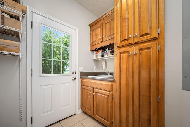 702 John Windrow Rd, Eagleville, TN 37060 - laundry room featuring light tile patterned floors and a sink