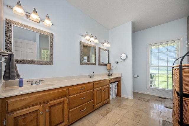 702 John Windrow Rd, Eagleville, TN 37060 - bathroom featuring double vanity and baseboards