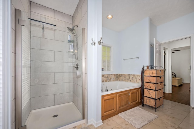 702 John Windrow Rd, Eagleville, TN 37060 - full bathroom featuring a shower stall, a garden tub, and tile patterned flooring