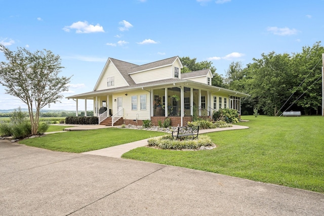 702 John Windrow Rd, Eagleville, TN 37060 - farmhouse inspired home with a front yard, a sunroom, roof with shingles, and covered porch