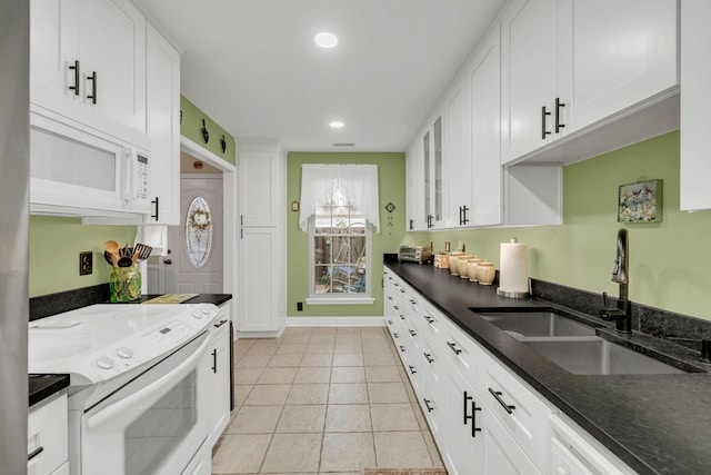 914 E Northfield Blvd, Murfreesboro, TN 37130 - kitchen featuring white appliances, white cabinets, dark stone countertops, glass insert cabinets, and recessed lighting