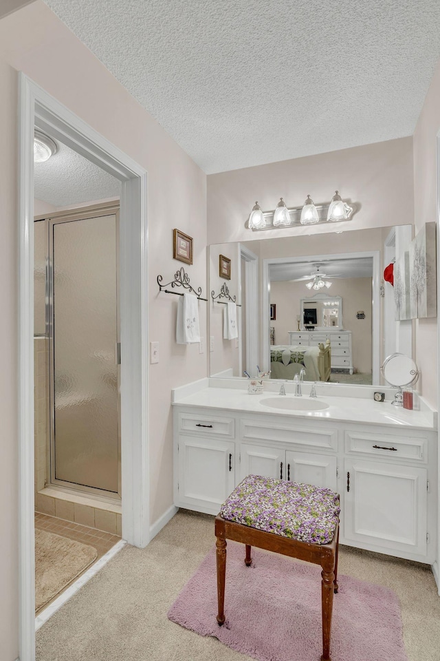 914 E Northfield Blvd, Murfreesboro, TN 37130 - ensuite bathroom with vanity, a stall shower, a ceiling fan, a textured ceiling, and carpet floors