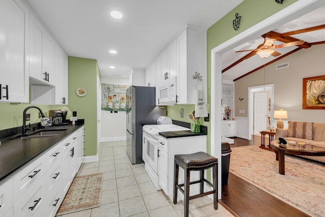 914 E Northfield Blvd, Murfreesboro, TN 37130 - kitchen featuring dark countertops, white cabinets, recessed lighting, a ceiling fan, and white appliances