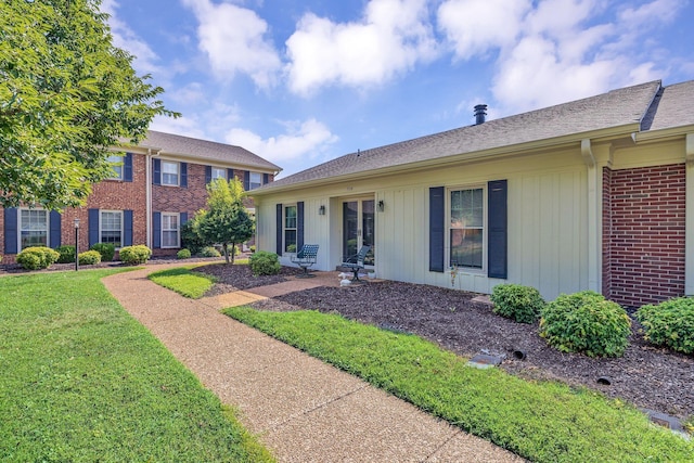 914 E Northfield Blvd, Murfreesboro, TN 37130 - view of front of property featuring board and batten siding, brick siding, and a front yard