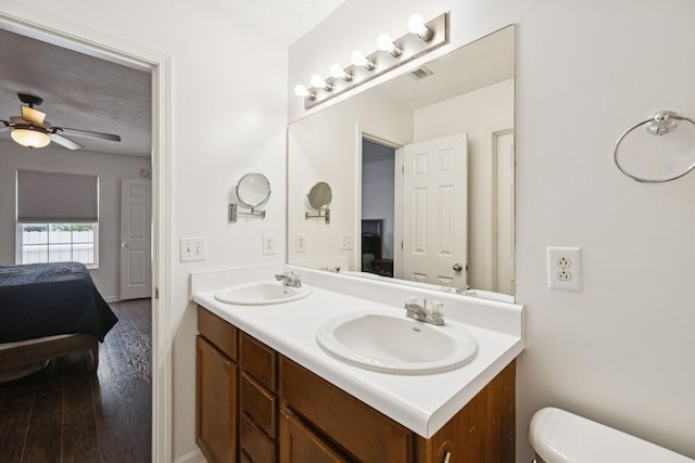 4826 Chelanie Cir, Murfreesboro, TN 37129 - bathroom featuring connected bathroom, double vanity, ceiling fan, and wood finished floors