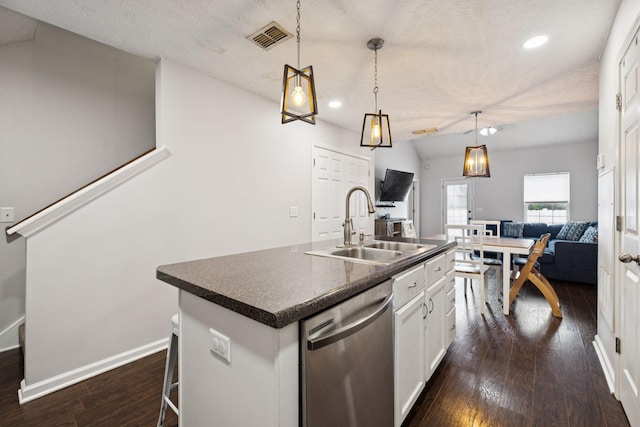 4826 Chelanie Cir, Murfreesboro, TN 37129 - kitchen with dark countertops, stainless steel dishwasher, dark wood-style flooring, recessed lighting, and white cabinetry