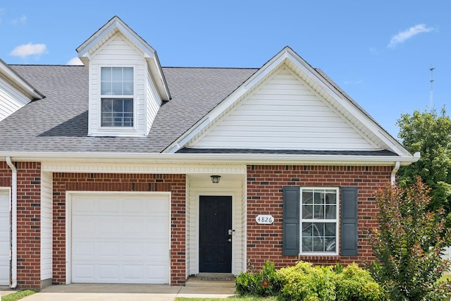 4826 Chelanie Cir, Murfreesboro, TN 37129 - view of front of house featuring brick siding, a shingled roof, driveway, and a garage