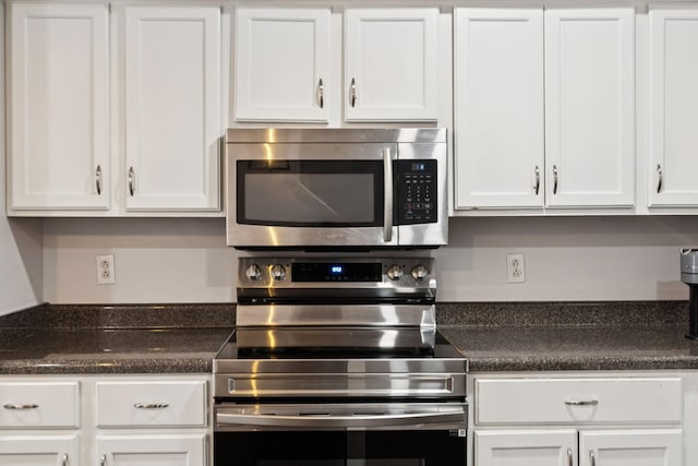 4826 Chelanie Cir, Murfreesboro, TN 37129 - kitchen with appliances with stainless steel finishes, white cabinets, and dark countertops