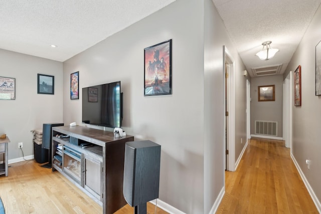 2261 High Meadow Dr, Murfreesboro, TN 37129 - hall featuring a textured ceiling, light wood-style flooring, and attic access