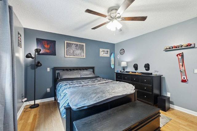2261 High Meadow Dr, Murfreesboro, TN 37129 - bedroom with light wood-style floors, a ceiling fan, and a textured ceiling
