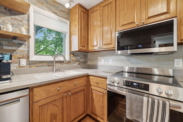 2261 High Meadow Dr, Murfreesboro, TN 37129 - kitchen with stainless steel appliances, decorative backsplash, light countertops, and brown cabinets