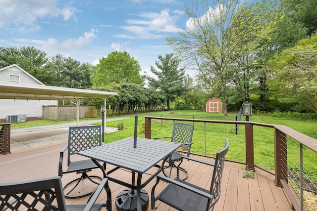 2261 High Meadow Dr, Murfreesboro, TN 37129 - wooden deck with a shed, outdoor dining space, a lawn, and view of scattered trees