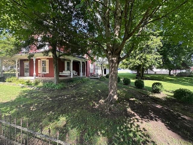 103 Cowan St W, Cowan, TN 37318 - view of grassy yard with a porch