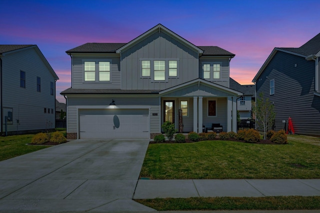 3612 Shady Forest Dr, Murfreesboro, TN 37128 - view of front facade with board and batten siding, concrete driveway, a lawn, an attached garage, and a porch