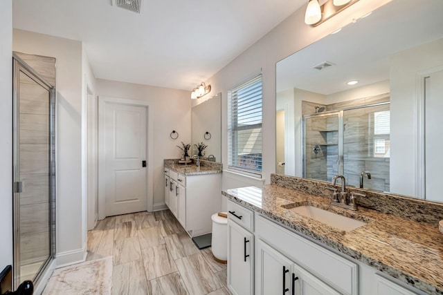 3612 Shady Forest Dr, Murfreesboro, TN 37128 - bathroom featuring a stall shower, two vanities, and marble finish floors