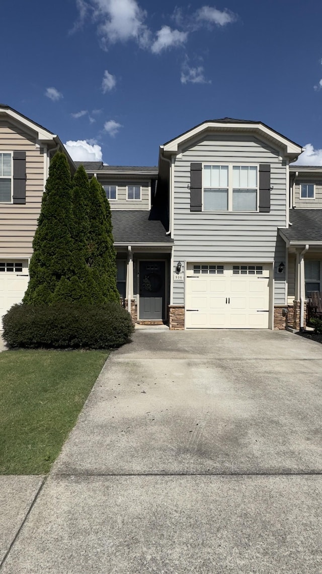 906 Thunder Gulch Way, Murfreesboro, TN 37128 - view of front facade featuring concrete driveway, an attached garage, and stone siding