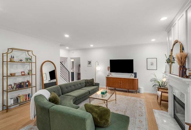 720 N Wickshire Way, Brentwood, TN 37027 - living room with a premium fireplace, recessed lighting, light wood-style flooring, and crown molding