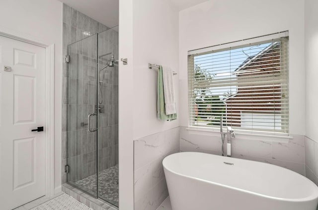 720 N Wickshire Way, Brentwood, TN 37027 - full bath featuring healthy amount of natural light, a freestanding bath, a shower stall, and tile walls