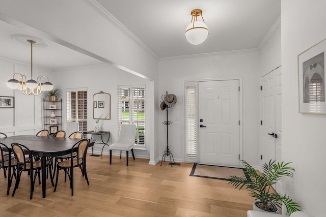 720 N Wickshire Way, Brentwood, TN 37027 - entryway with light wood-type flooring, crown molding, and a chandelier