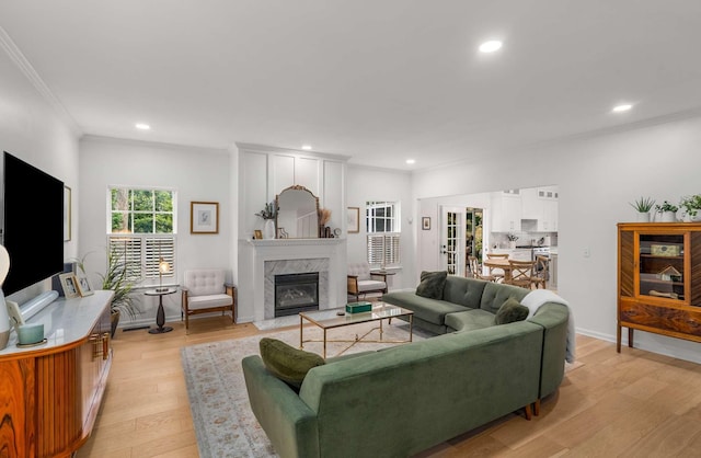 720 N Wickshire Way, Brentwood, TN 37027 - living area with ornamental molding, recessed lighting, light wood finished floors, and a high end fireplace