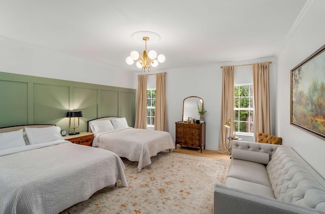 720 N Wickshire Way, Brentwood, TN 37027 - bedroom with a chandelier, ornamental molding, light wood-style floors, and a decorative wall