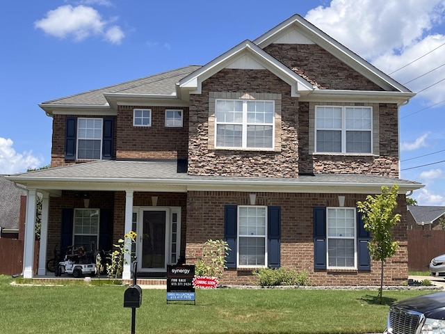 4093 Locerbie Cir, Spring Hill, TN 37174 - view of front of property featuring roof with shingles, covered porch, and brick siding