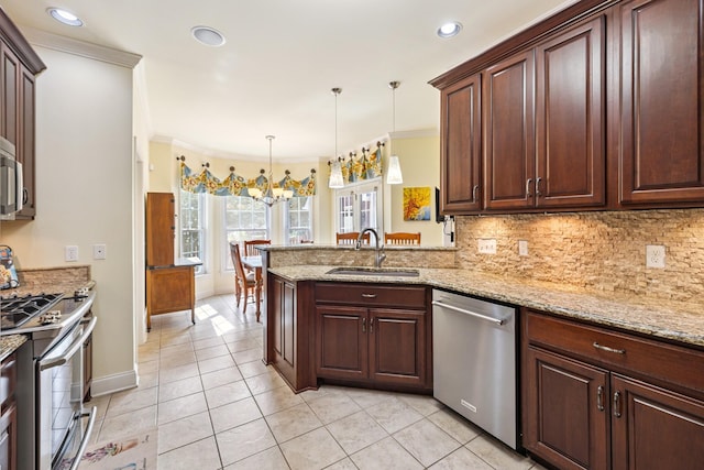 835 Banner Dr, Murfreesboro, TN 37129 - kitchen with stainless steel appliances, a peninsula, tasteful backsplash, light tile patterned flooring, and pendant lighting