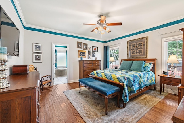 835 Banner Dr, Murfreesboro, TN 37129 - bedroom featuring wood finished floors, crown molding, ensuite bathroom, and ceiling fan