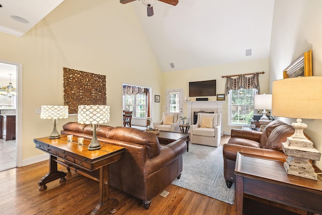835 Banner Dr, Murfreesboro, TN 37129 - living room with high vaulted ceiling, a fireplace, a ceiling fan, and wood finished floors