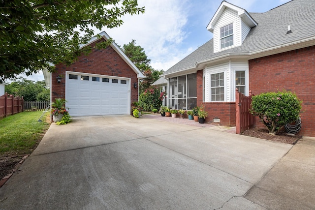 835 Banner Dr, Murfreesboro, TN 37129 - view of side of property featuring a sunroom, brick siding, a shingled roof, and an outdoor structure