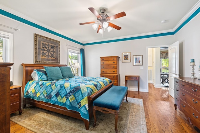 835 Banner Dr, Murfreesboro, TN 37129 - bedroom featuring wood finished floors, multiple windows, ornamental molding, and ceiling fan